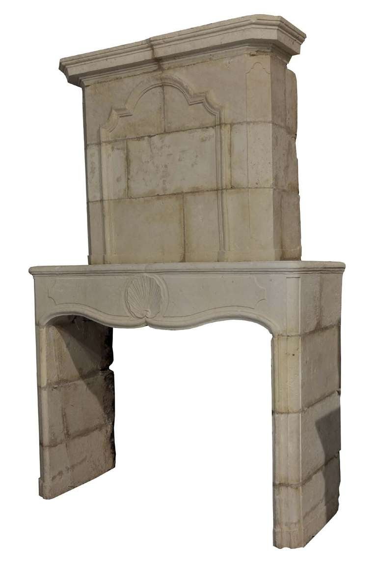French Louis the 14th period limestone fireplace dated early 18th century. Origin: West France - Fontnay Le Comte area - Opening: 41 in. H, 53 in. W, # C3304.