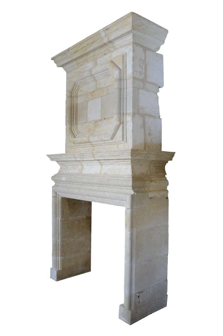 A French Louis XIV period limestone fireplace dated 17th century. Little restorations. Origin : Saint Emilion area (Aquitaine). Opening : 48 x 52 in. # C3367