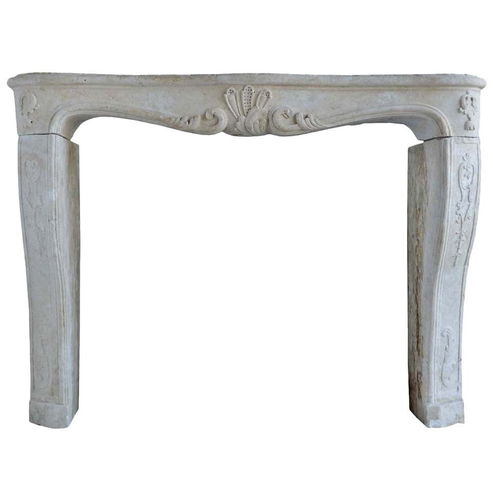 French Louis XV Period Limestone Fireplace, 18th Century