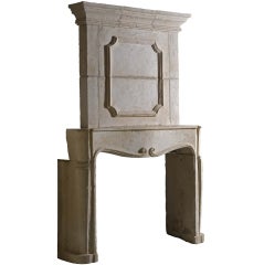 Antique French Louis the 14th period limestone fireplace