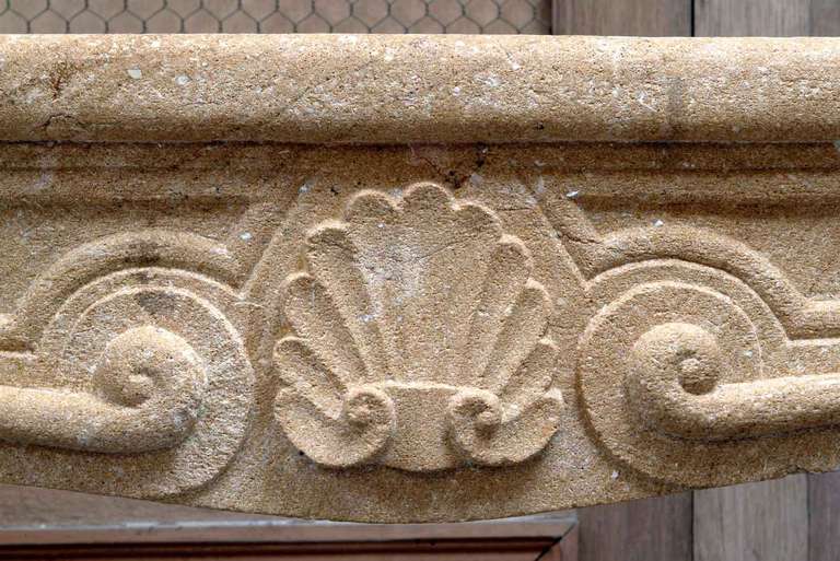 A French Louis the 15th period limestone fireplace. Origin: Burgundy. Little accidents. Measures: Opening 32 in. H. - 41 in. W. # C2719.