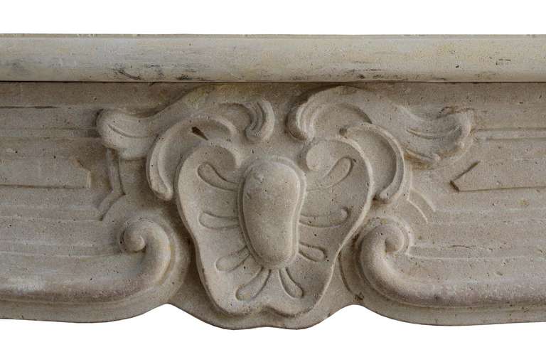 18th Century and Earlier French Louis XV Period Limestone Fireplace, 18th Century