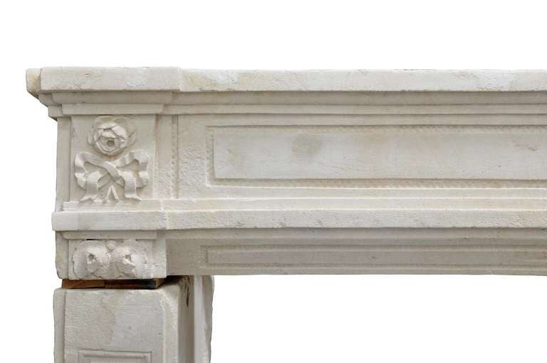 A French Louis the 16th period limestone fireplace dated late 18th century. Little restorations. Opening: 39 in. H., 59 in. W. # C3247.