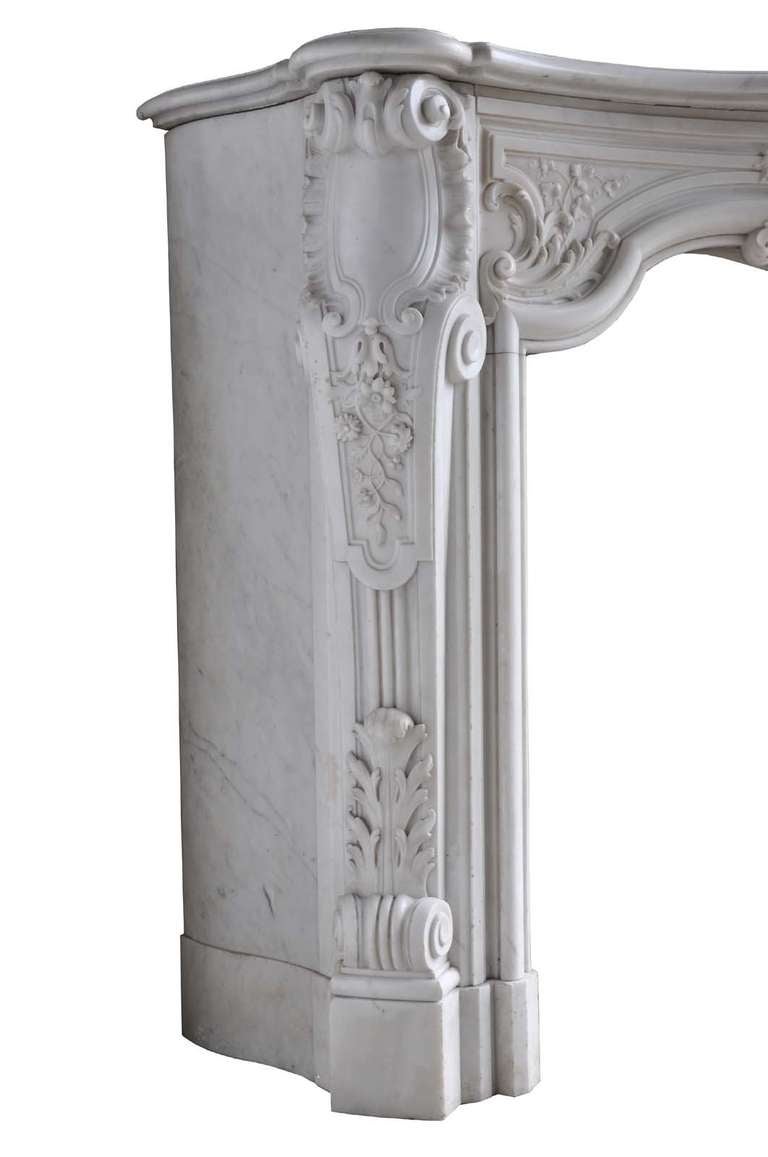 A rare French Louis XV style white marble fireplace and its cast iron fireback. Opening : 35 x 26 in.
Origin : Paris