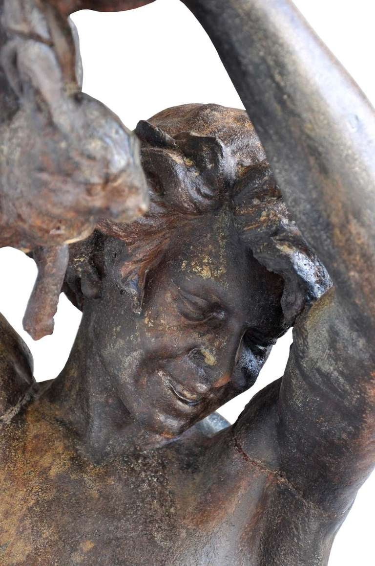 Apollo hunter, a life-size french cast-iron figure,  cast by Val d'Osne from a model by Mathurin Moreau. The man is holding a rabbit in his hands, and his hunting dog is sited next to him. Ca.1870. 
Stamped : Val d'Osne - 58 Bd Voltaire - Paris.
#