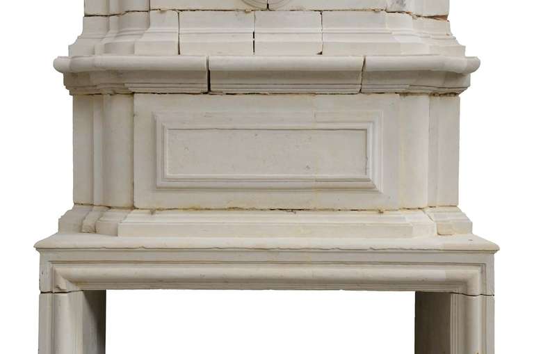 French Louis the 14th period limestone fireplace dated late 17th century or early 18th century. Restored. Origin : Charente (West of France). Opening : 40 x 57 in. Ref. C3415.