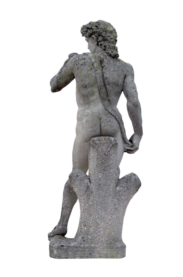 After Michelangelo: a carved stone figure of David, circa 1960. Base: 53 x 51 in. # E3697.