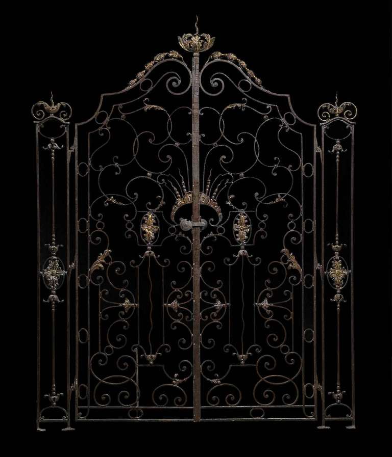 A rare French Louis XV style wrought iron gate and its side grilles dated 19th Century. # G0327
Dimensions :
- Side grilles : Height - 67 in. , width - 6 in.
- Gate : Height - 81 in. , width - 48 in.