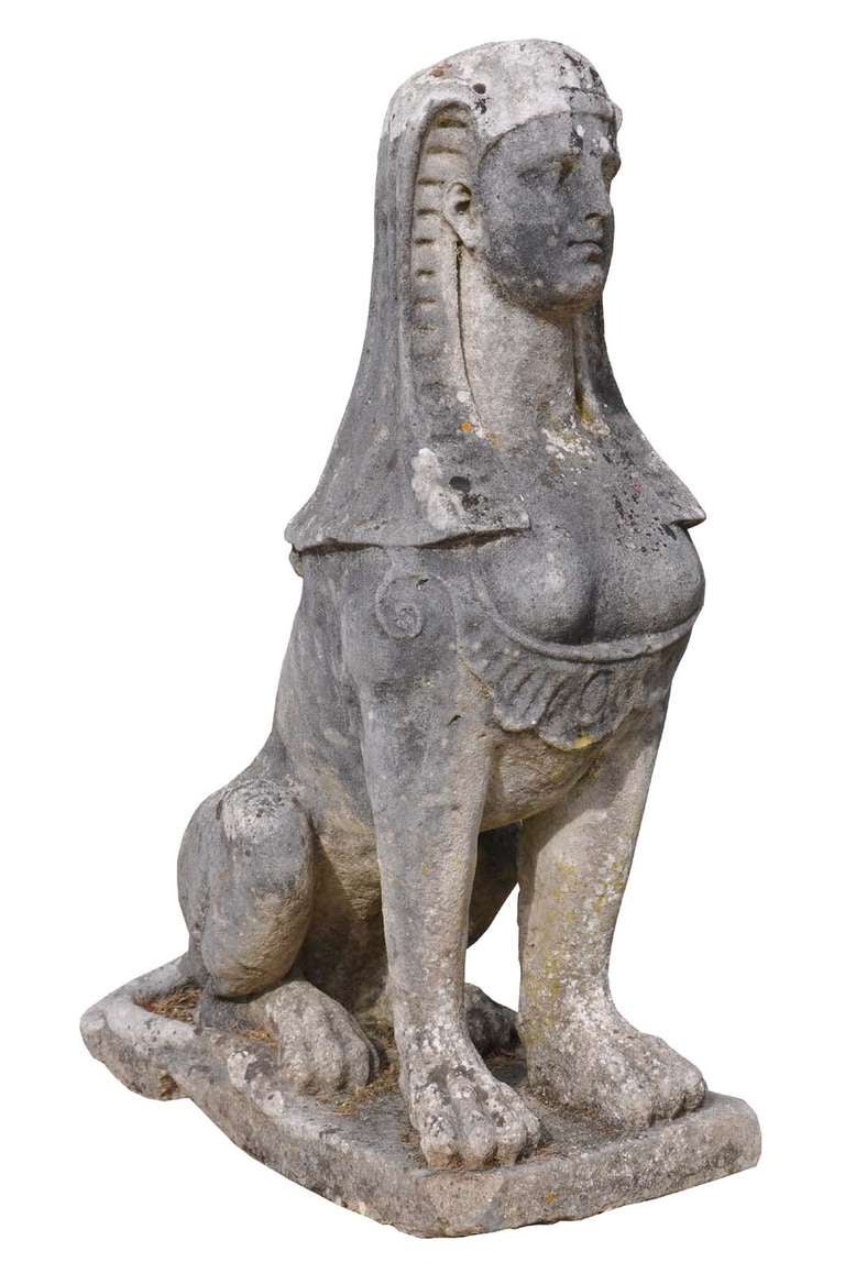 A pair of George III portland stone sphinxes dated late 18th century