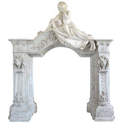 Carrara Marble Fireplace Surmounted by a Marble Putto, 19th Century