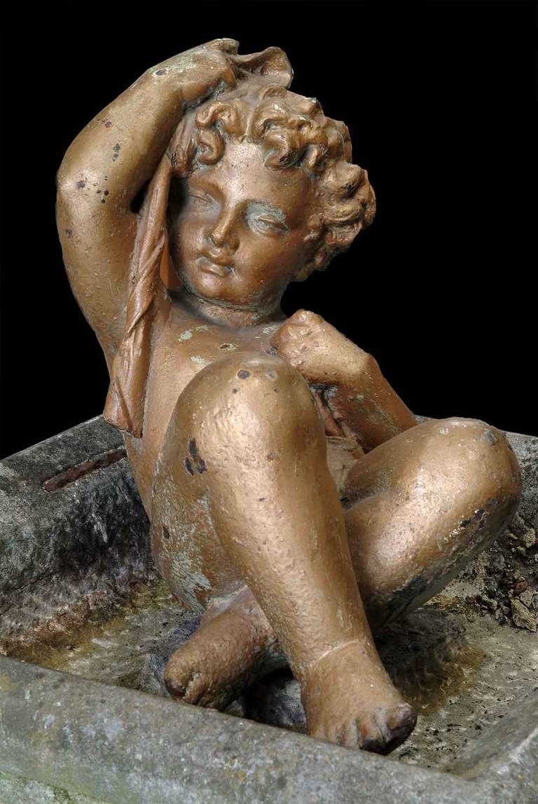 19th Century cast iron figure of a putto (Candelabra  element). Illustration document : New York - Central park. # E4613