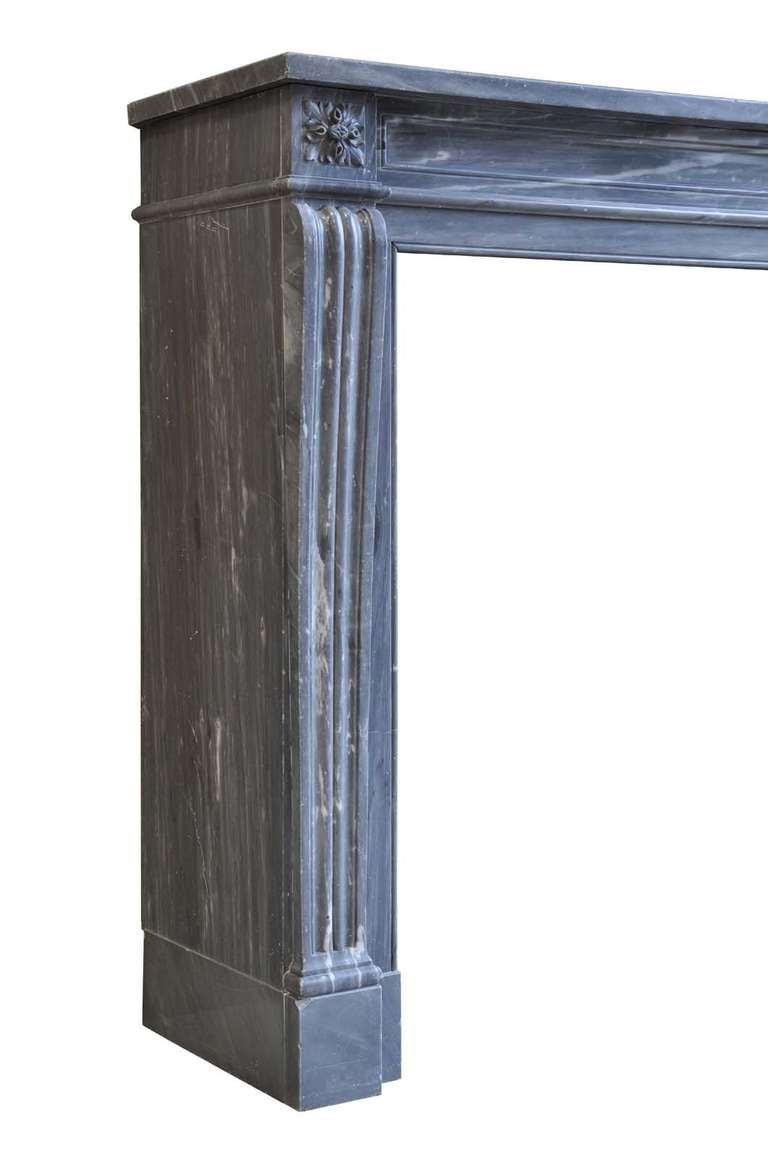 French Louis the 16th style grey marble fireplace dated late 19th century. Origin : Paris - Hôtel Crillon - Suite Leonard Bernstein. Opening : 34 in. H. x 32 in. W. Opening with the cast iron fireback : 22 in. H. x 18 in. W. # C3327