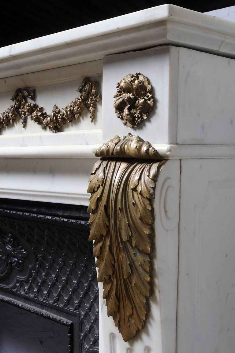 French Louis XVI White Marble and Gilded Bronze Fireplace 19th Century