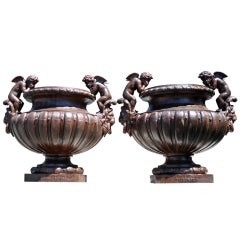 Pair of French Louis XIV style cast iron vases