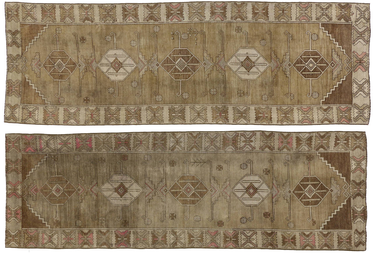 51046-51047 Pair of Vintage Turkish Oushak Runners, Matching Hallway Runners. Warm and inviting combined with the right amount of modern aesthetics and tribal elements, this pair of matching Oushak hallway runners charm with ease. Each runner