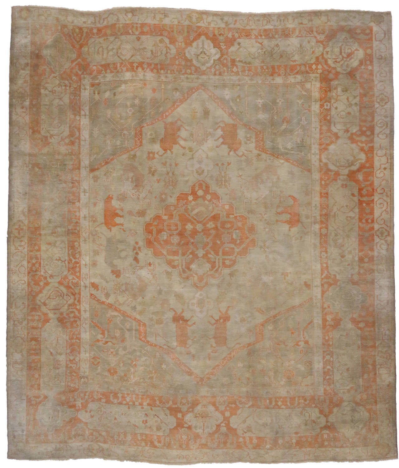 74255 Rare Antique Turkish Oushak Palace Size Rug with Elephant Motifs. Oushak stands for the western Anatolian Turkish city, known for its rare collectible rugs made during the Ottoman Empire. Hand woven from soft, silky wool and featuring warm,