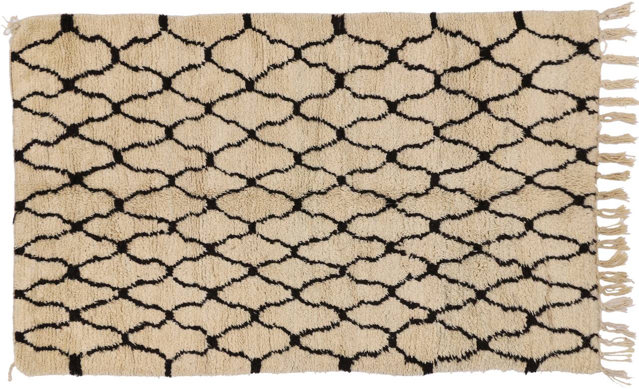 This mid century Moroccan can harmonize disparate elements, bring about soothing serenity, and add texture to your interior space with its sumptuous and shaggy pile with abstract geometric patterns. This is a wonderful example of a vintage Moroccan