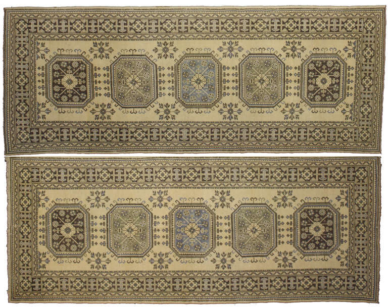 50920 and 50921 Pair of Vintage Oushak Runners with Modern Design in Muted Colors. Nearly identical vintage Oushak runners in excellent condition, like this pair, are rare and highly sought after pieces by collectors, rug enthusiasts and savvy