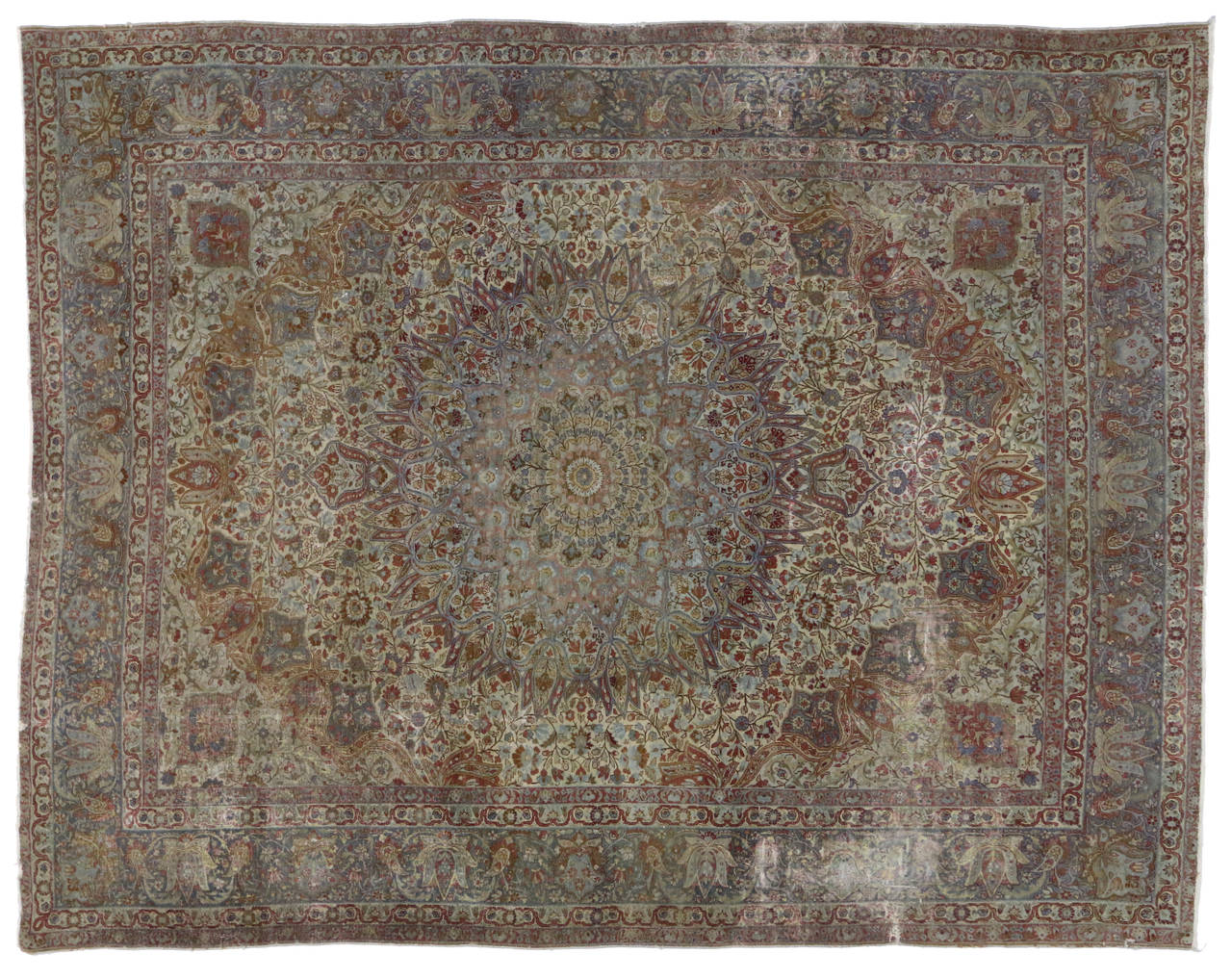 This Late 19th century Persian Kerman (Kirman) features a grand scale center medallion with delicately colored floral and botanical motifs and sweeping vines meander across the field creating an overall luxurious design scheme. Decorative palmettes