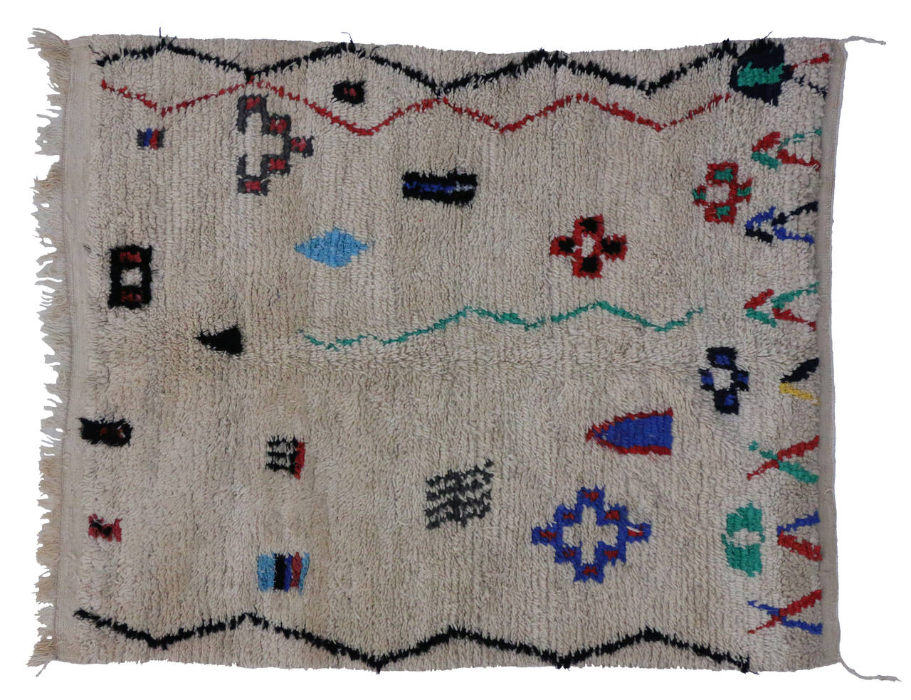 Moroccan rugs from the Azilal region are notable for their dynamic colorful designs and for their strong sense of geometric structure. While the patterns may seem whimsical and random – they are very significant to the rug weaver’s life. The Berber