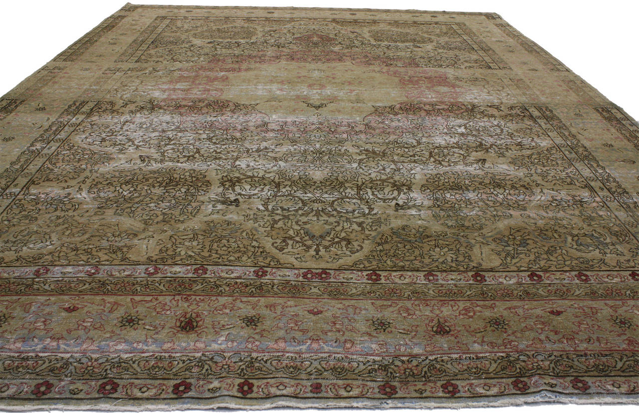 72742 Distressed Antique Persian Kermanshah Area Rug with Romantic Industrial Style. This hand-knotted wool distressed antique Kermanshah area rug captures a breathtaking majesty expressed through its romantic Industrial style. It features a