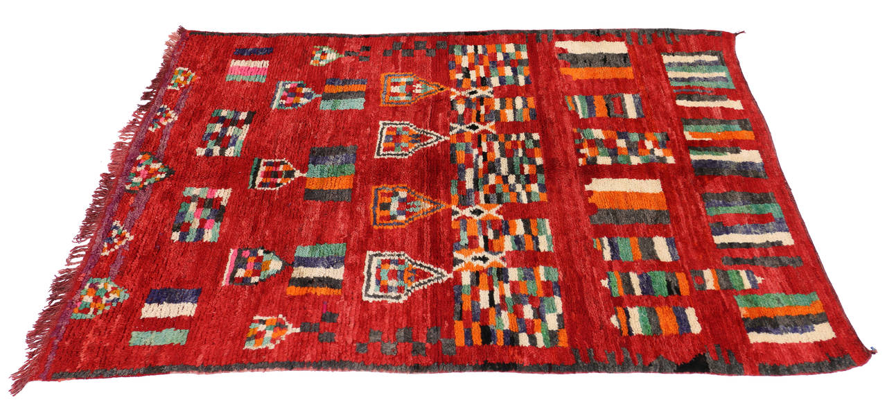 74789 Animated with Berber tribe motifs and secondary protection symbols, this hand-knotted wool vintage Berber red Moroccan rug offers many meanings that are represented through its geometric shapes. A series of pentagons possibly representing