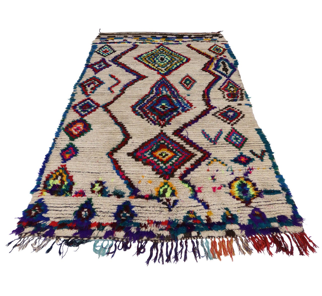 Blending the graphic appeal and folk-art warmth from the Berber Tribes of Morocco, this vintage Moroccan rug features a contemporary abstract design. Lacking a written language, Berber Tribe weavers incorporated ancestral myths into their textiles