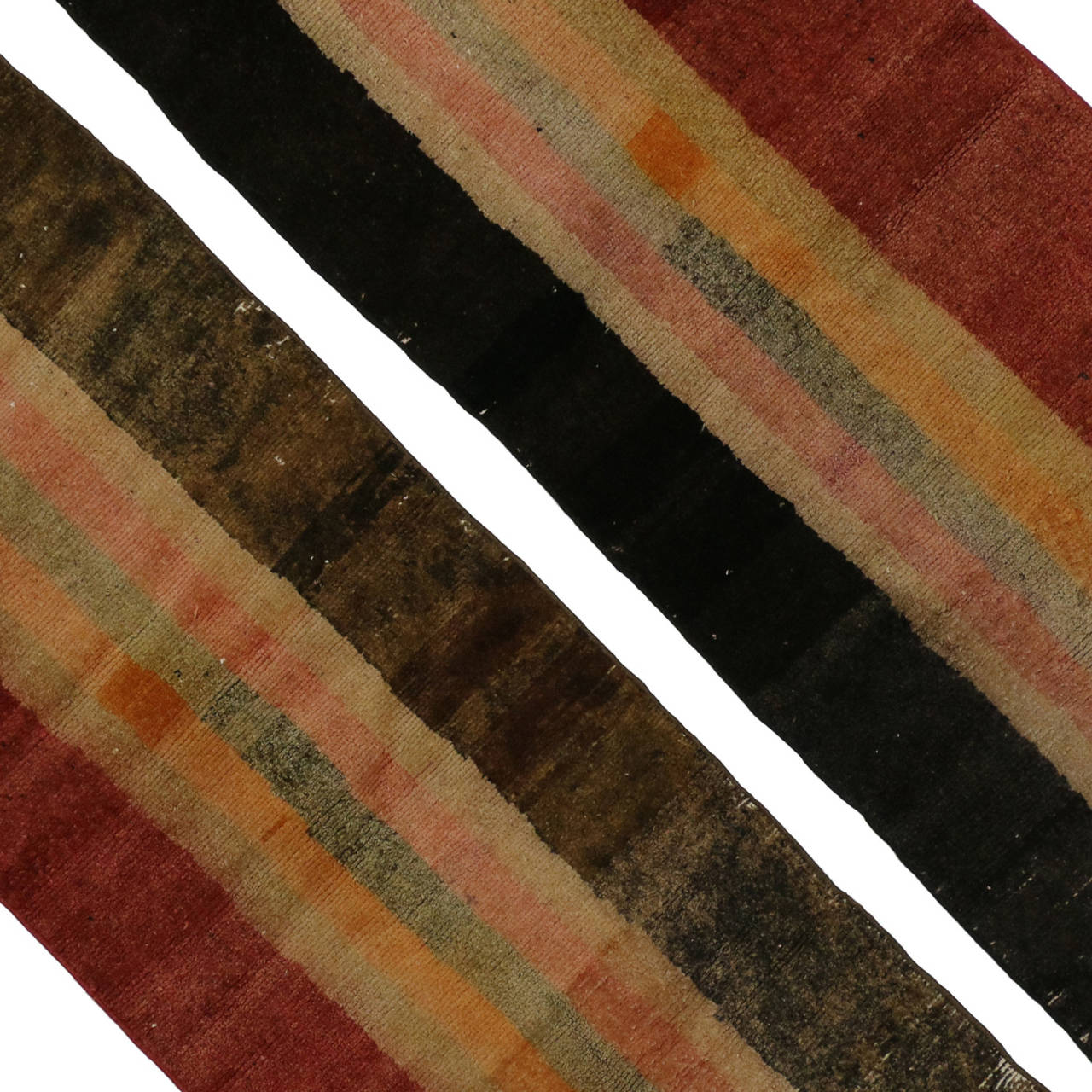 Create a comfortable and modern setting with this pair of vintage shag runners. Featuring a Mad Men color palette, these earthy shades of brown, orange, brick red and black are excellent color combinations for making an interior space feel both