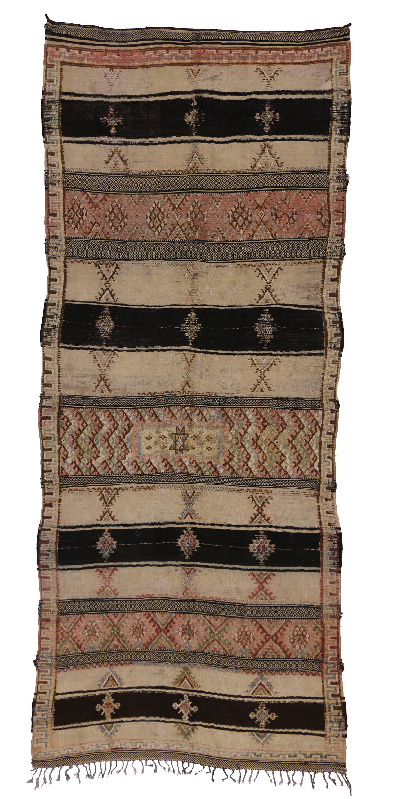 The Berber women incorporate design elements from their personal experience into the rugs designs. The symbols are usually references to events and aspects of their daily life such as beliefs, birth, fertility, nature, femininity, life and