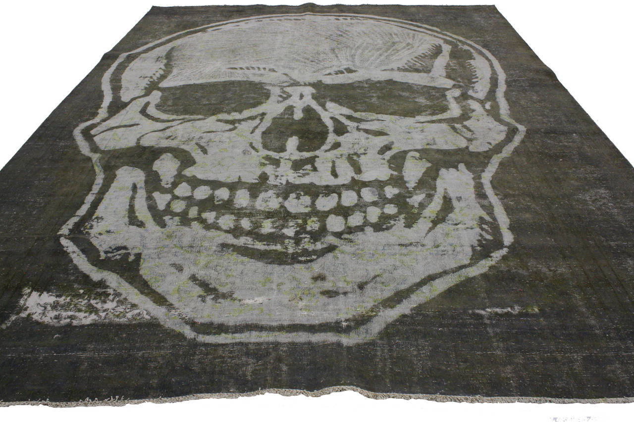 Inspired from Victorian Gothic decor and atmospheric design, this vintage overdyed rug is not for the faint of heart with its smiling skull. It’s all about making a statement with drama, boldness and elegance. In a world of bland, staged,