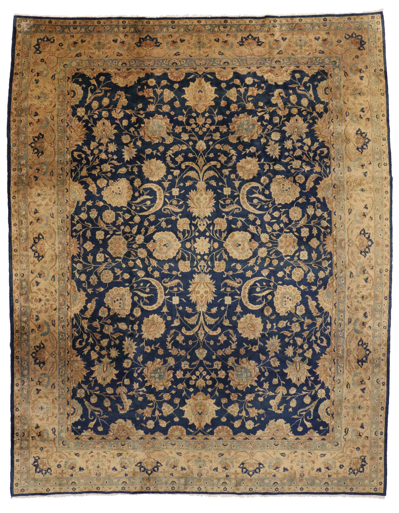 73489 Antique Indian Agra Rug with Hollywood Regency Style. Saturated in an extraordinary palette of midnight navy blue and golden fawn, this antique Indian Agra showcases an exquisite allover pattern. The arabesque vines meander through a medley of