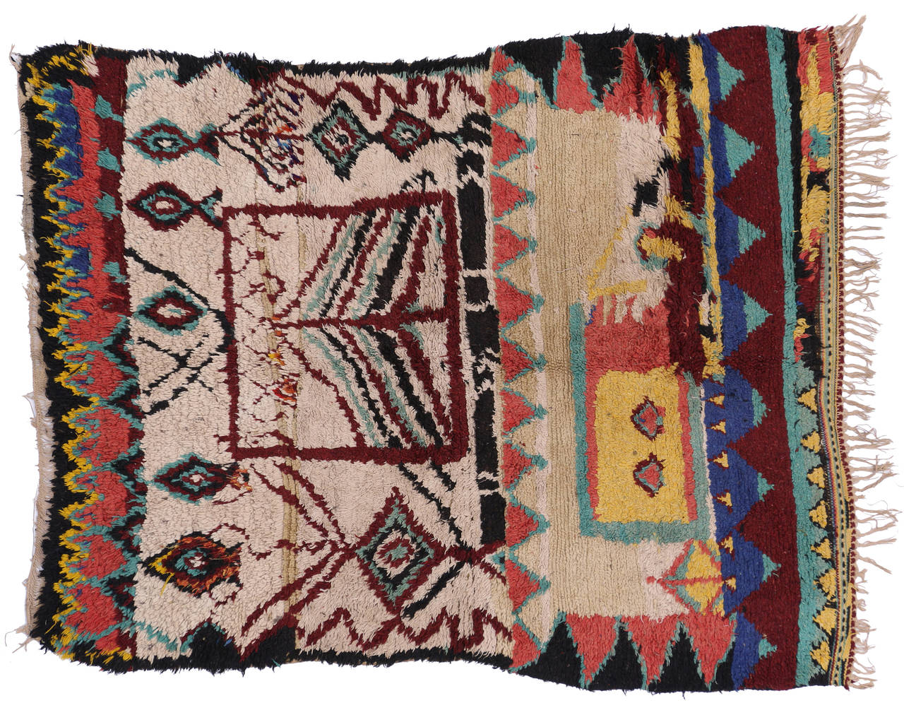 This unique vintage Moroccan Azilal rug has an eclectic design with Navajo colors like maroon, blue, green, red and yellow. Azilal rugs with their sumptuous texture and sturdy weave make them an ideal statement rug for any room. The Berber women,