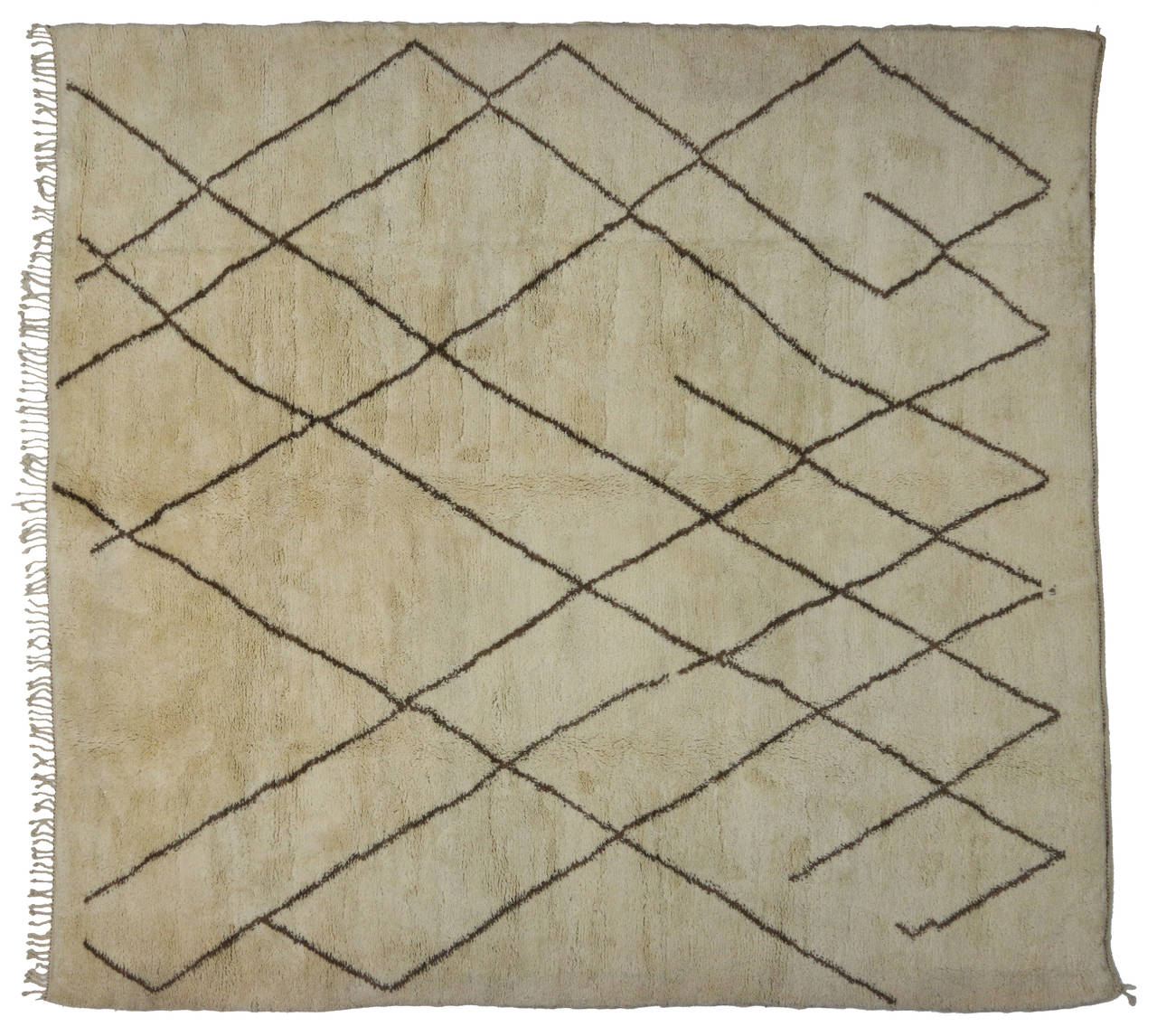 This Moroccan area rug harmonizes disparate elements, brings soothing serenity while adding texture and depth to your space. This is a wonderful example of a Moroccan rug, woven with a clean and simple, yet sophisticated composition. The off white,