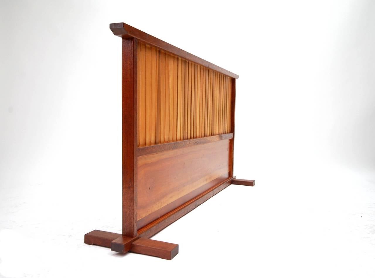 Small Japanese style room divider designed and built by Japanese born Teruo Hara (1929-1986). Hara, best known for his pottery, was also a woodworker. In 1977 he designed and built the famed 