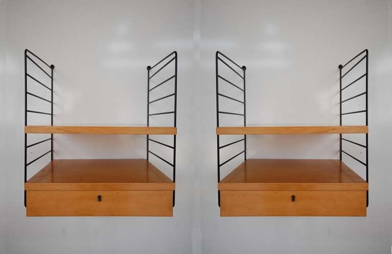 Wall Hung Nightstands by Swedish Architect Nils Strinning, circa 1949. One can configure the shelves and drawer unit to any number of positions within the metal brackets. Each of the drawers units has beautiful, hand cut dovetails, and a lock with a