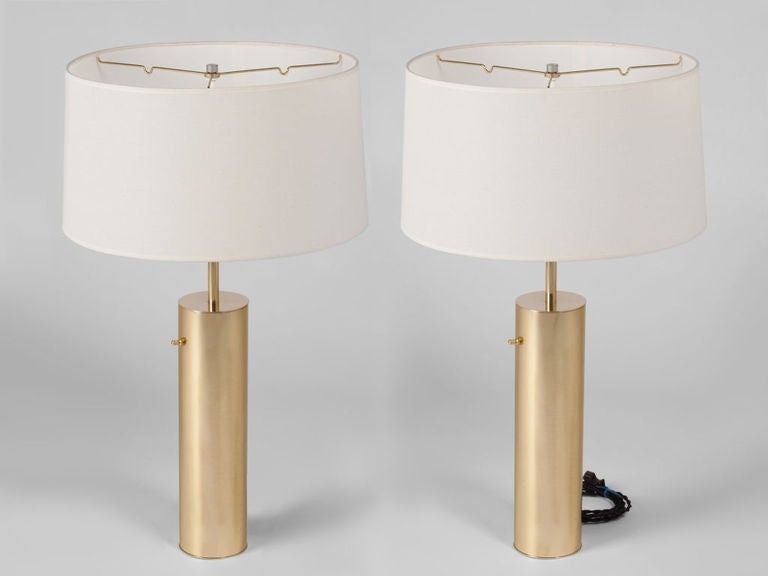 Pair of cylinder form brushed brass table lamps by Nessen. Lamps have been completely restored. 2 pair in high polished brass currently available. (the brushed brass version is show)  5 lamps total available. Singles available at $1600.00