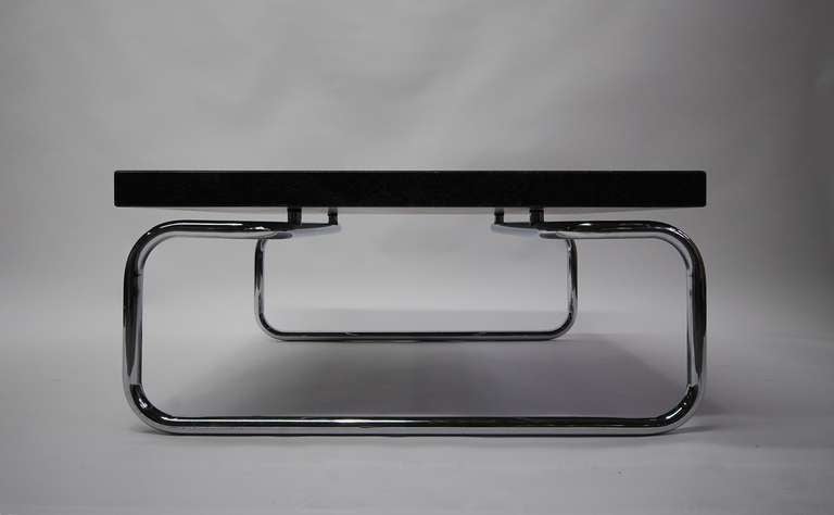 Tubular chrome frame coffee / cocktail or side table with 2 in. thick. square black granite top designed by Michael McCarthy for Cassina. Italy, circa1968.

LUNA offers free delivery on most of our items within the Long Island / Greater NYC,