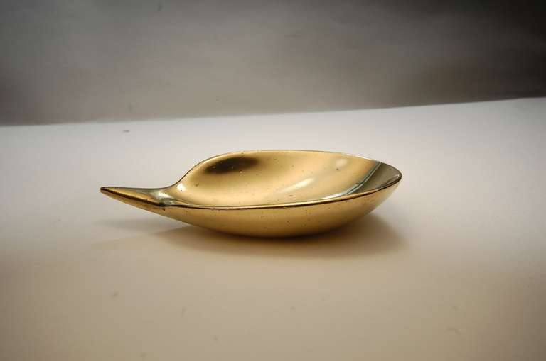 Brass dish by Austrian industrial designer Carl Aubock, circa 1955. Fully signed.

We offer free delivery on most of our items within the Long Island / Greater NYC, northern New Jersey, Connecticut and Massachusetts areas. Please inquire for