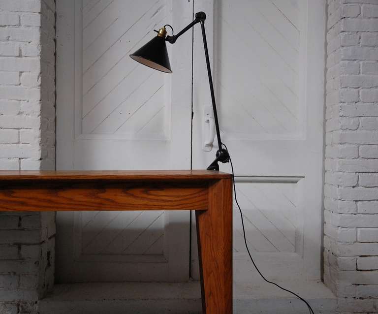 G.R.A.S. Architect's Lamp by G.R.A.S. Ravel, France.  Circa 1930's. Black enameled steel, with brass socket. Professionally rewired (rayon covered cord) for safety, as all of our lamps are.

We offer free delivery within the Long Island / Greater