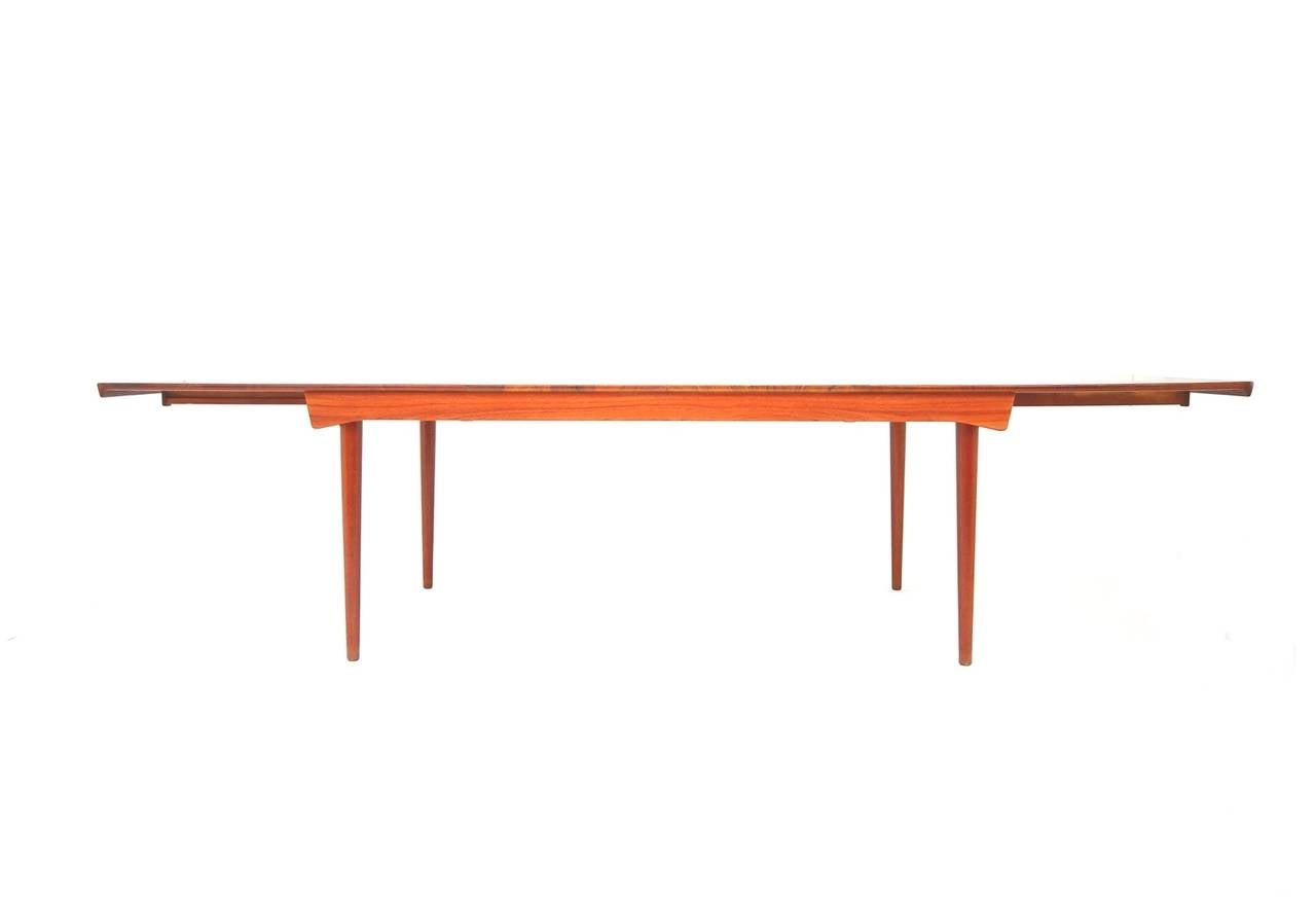 Finn Juhl 540 extension dining table designed, circa 1963 and produced by France & Daverkosen of Denmark. Unlike most dining tables, the 540 extension dining table is constructed entirely of solid teak. No veneer over core. Two leafs, each measuring