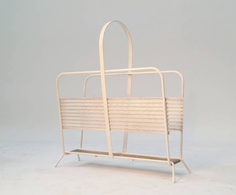 Magazine rack designed by Mathieu Matégot, France circa 1950's.

We offer free delivery on most of our items within the Long Island or Greater NYC, northern New Jersey, Connecticut and Massachusetts areas. Please inquire for further details. We