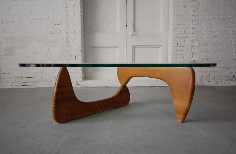Early and iconic Noguchi IN-50 coffee/cocktail table in birch. Bases were only available in birch from 1947-1954, making this particular model fairly scarce. They are more commonly seen in walnut or black lacquer.

We offer free delivery on most