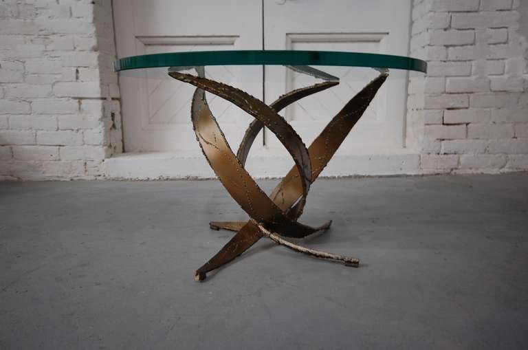 Brutalist, flame cut steel occasional table with round glass top by Silas Seandel.

 