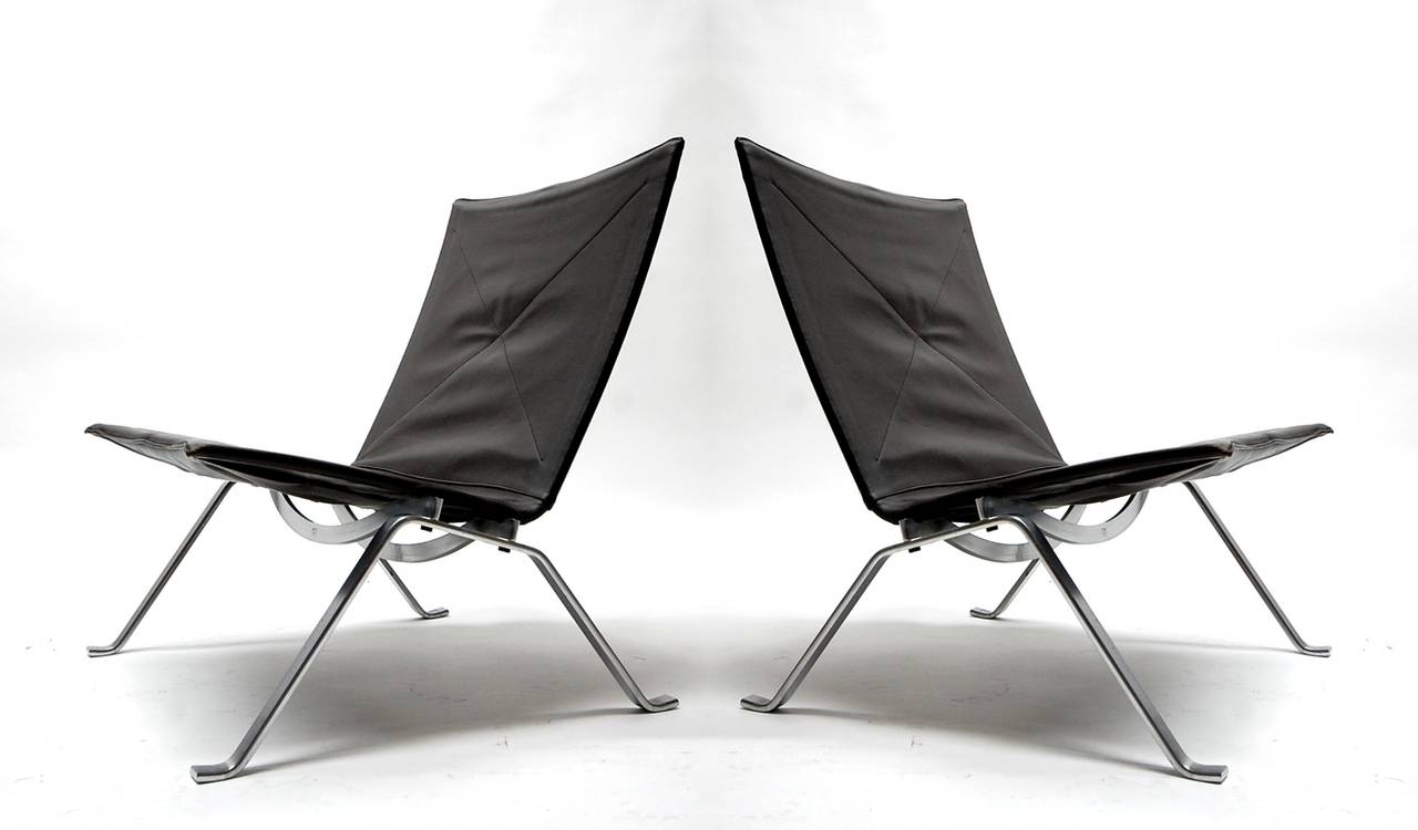 Pair of PK22 lounge chairs designed by Poul Kjaerholm and manufactured by E. Kold Christensen of Denmark. Chairs retain their original chocolate brown leather covers. Excellent original condition.

We offer free delivery on most of our items