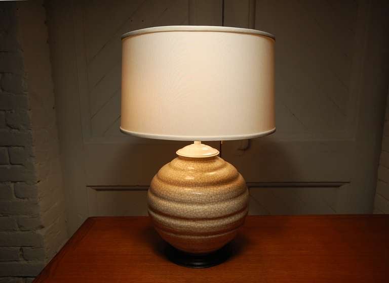 French pottery lamp, circa 1930's, with a heavy crackle glaze.  In the manner of Jean Besnard. Signed on bottom, 