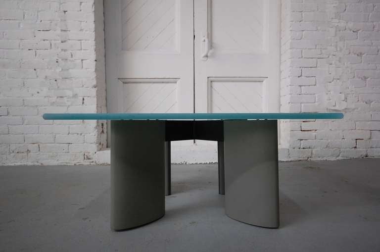 Koch & Lowy cocktail / low table designed by Architect Piotr Sierakowski, circa 1989. Glass, sand blasted on 5 sides (one surface and four edges), extruded aluminum legs, with a painted black aluminum cruciform cross stretcher. Due to it's size, the