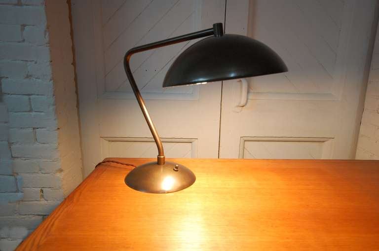 Desk lamp attributed to Kurt Versen, circa 1945, with bronzed finish.

LUNA offers free delivery on most of our items within the Long Island / Greater NYC, northern New Jersey, Connecticut and Massachusetts areas. We also offer free packing and