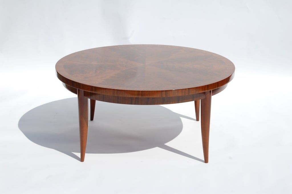 Round cocktail table with highly figured, book matched,crotch mahogany veneer top. Table is finished in a high gloss, hand rubbed clear lacquer.

We offer free delivery within the Long Island / Greater NYC,
northern New Jersey, Connecticut and