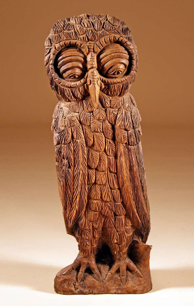 Talk about bedroom eyes! (Robert Mitchum....Simone SIgnoret?) 

A large standing carved Folk Art owl...a great example of naive carving, this fellow is an amusing and somewhat sleepy visage.

He has adorned the mantel for years.  Now he wants to