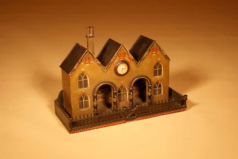 A pleasant Victorian miniature model of a train station.  

It is Dated 1860 and bears the initials 